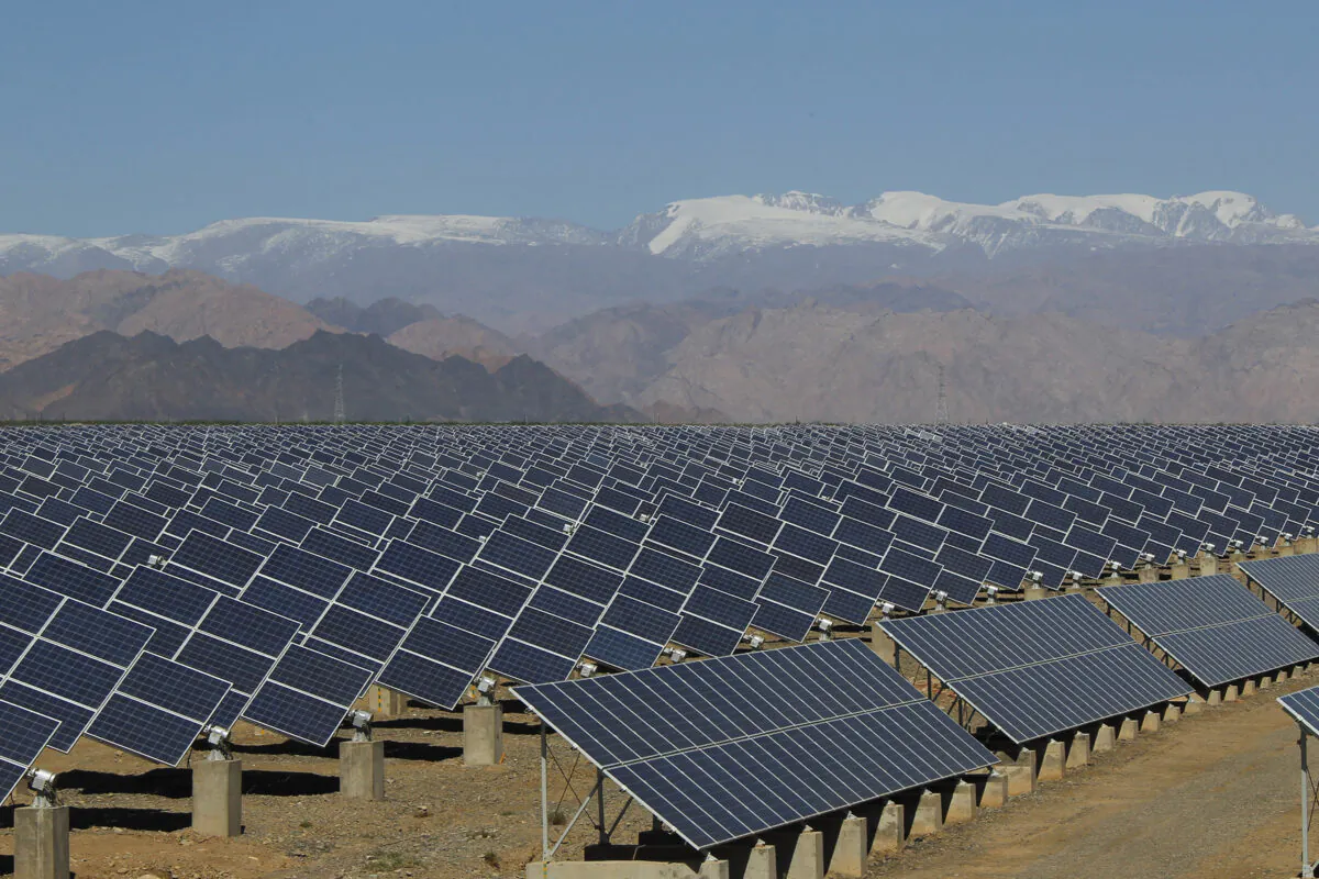 Large solar panels are seen in a solar power plant in Hami, northwest China's Xinjiang Uyghur Autonomous Region, on May 8, 2013. (STR/AFP via Getty Images)