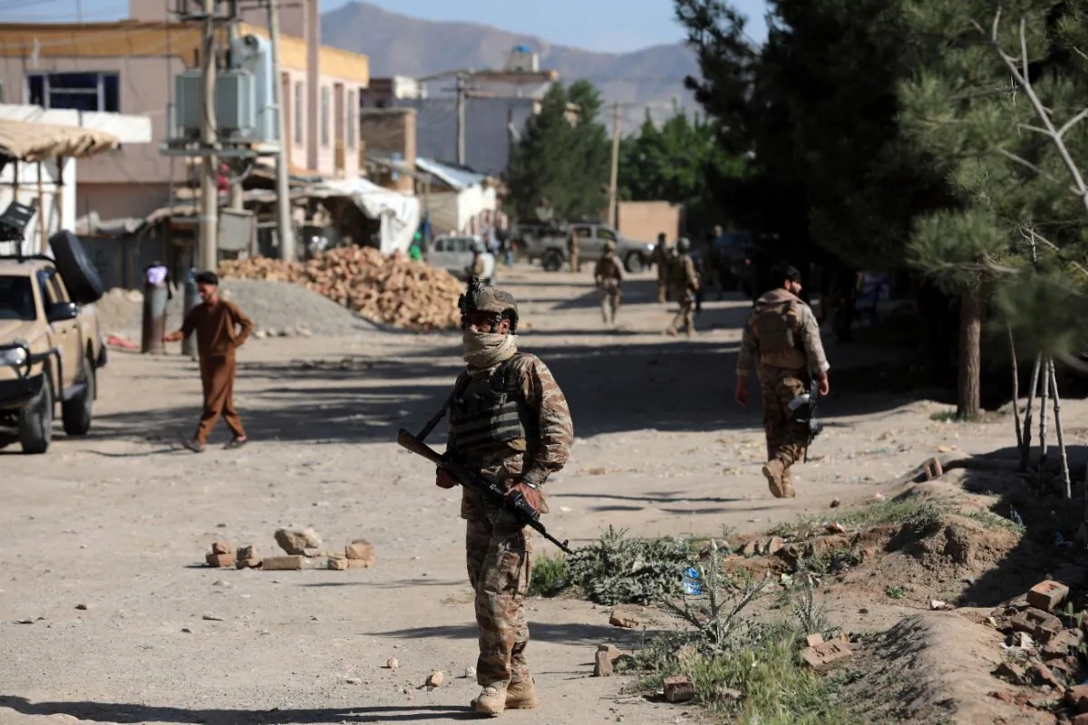 Afghan security personnel arrive at the site of a bomb explosion in Shakar Dara district of Kabul, Afghanistan, on May 14, 2021. (Rahmat Gul/AP Photo)