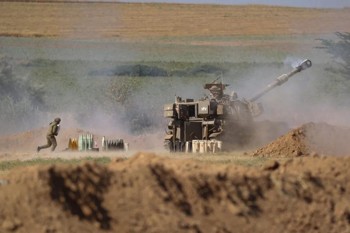 An Israeli artillery unit fires toward targets in the Gaza Strip, at the Israel-Gaza border, on May 15, 2021. (Ariel Schalit/AP Photo)