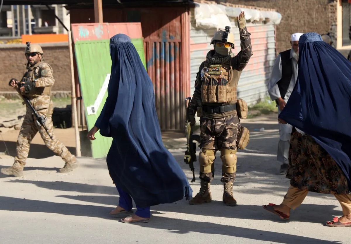 Afghans stand near to mosque after a bomb explosion in Shakar Dara district of Kabul, Afghanistan, on May 14, 2021. (Rahmat Gul/AP Photo)