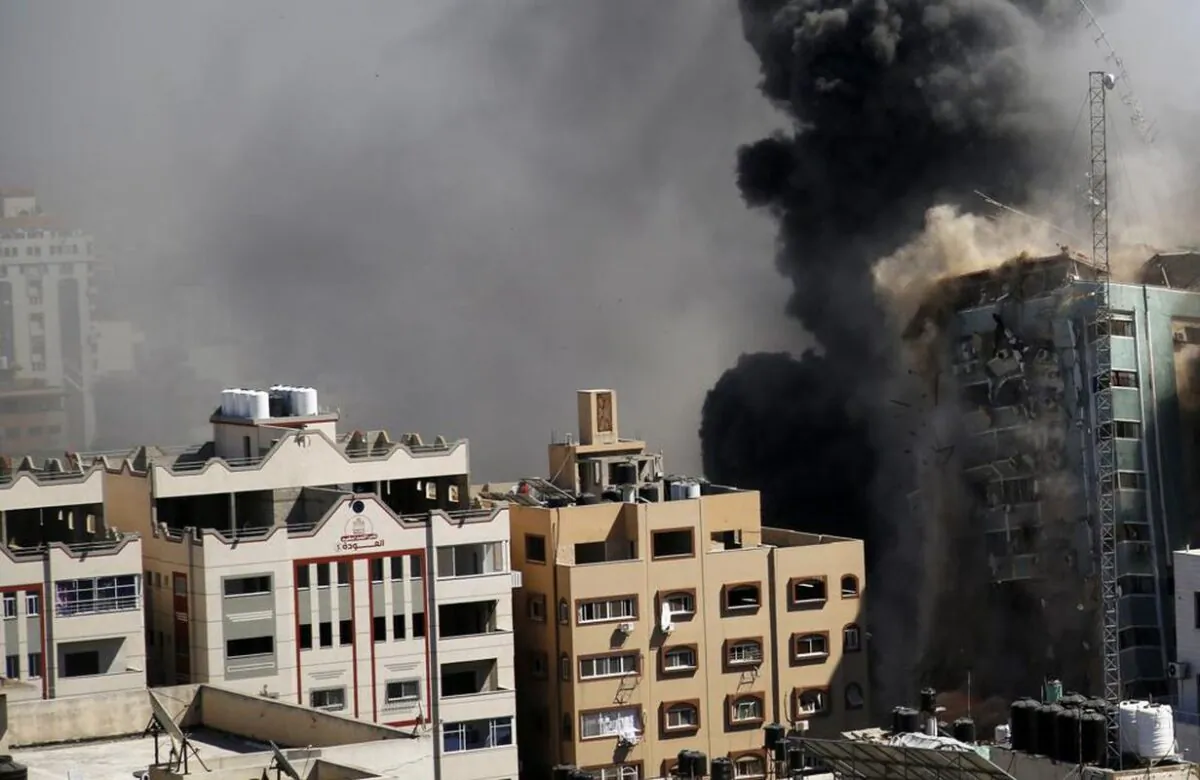 An 11-story building housing the AP office and other media in Gaza City, moments after Israeli warplanes demolished it, on May 15, 2021. (Hatem Moussa/AP Photo).
