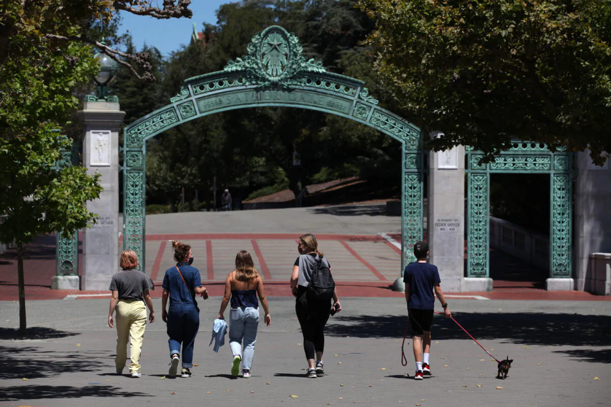 People walk toward Sather Gate on the U.C. Berkeley campus in Berkeley, California, on July 22, 2020. (Justin Sullivan/Getty Images)