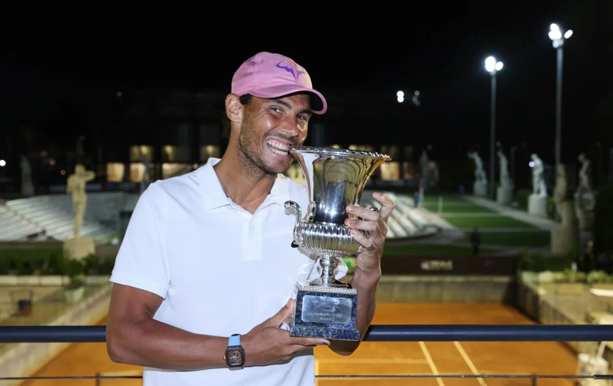 Rafael Nadal of Spain celebrates with the trophy after winning the final over Novak Djokovic of Serbia during the men's final at Foro Italico in Rome, Italy, on May 16, 2021. (Clive Brunskill/Getty Images)