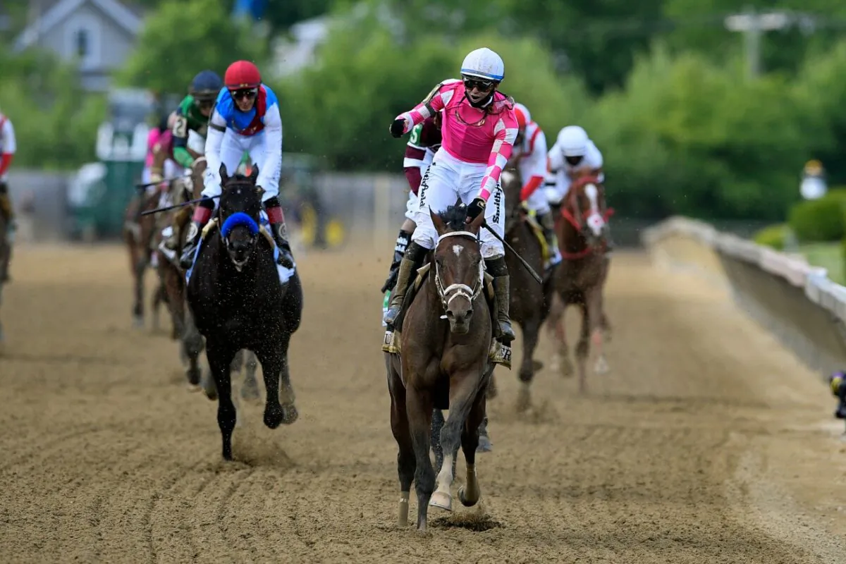 Flavien Prat atop Rombauer (C) reacts after winning the Preakness Stakes horse race at Pimlico Race Course,  in Baltimore, on May 15, 2021. (Nick Wass/AP Photo)