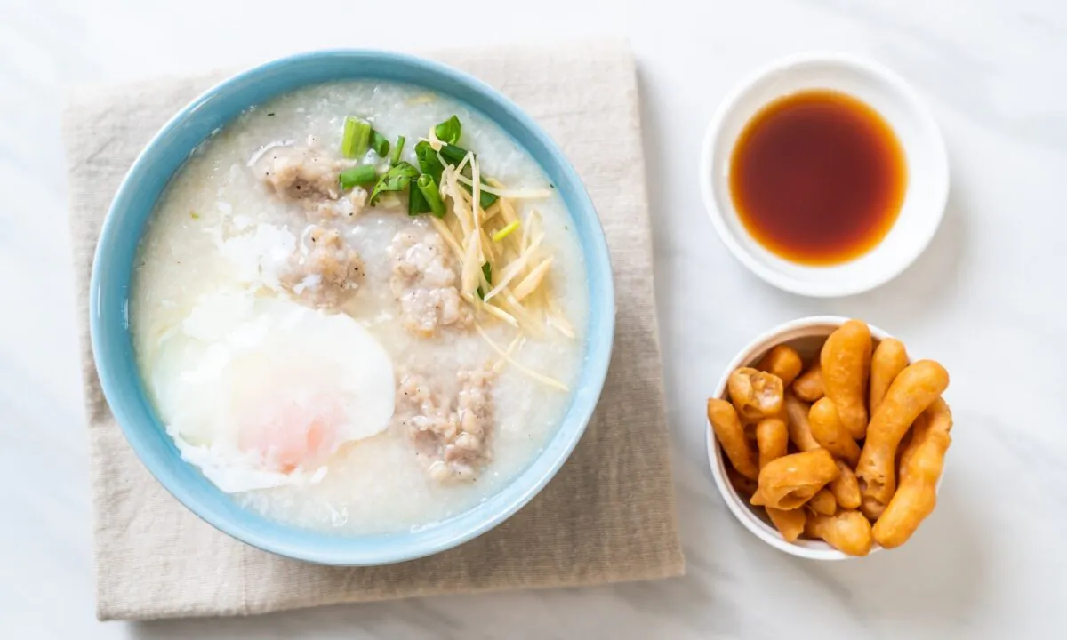 All the variations of congee simmer down to the same basic idea: Cook a little rice in a lot of water, until you have a thick, warm cloud. Simply add flavor, and serve. (gowithstock/Shutterstock)