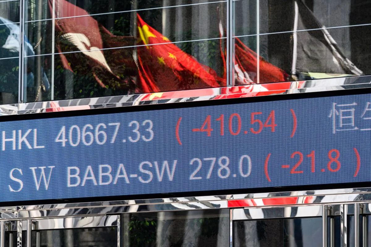 Alibaba Group Holding Ltd's stock prices (BABA-SW) (top C) drop in the Hong Kong Stock Exchange on Nov. 4, 2020, after its financial wing Ant Group’s record-breaking IPO was suspended the night before. (Anthony Wallace/AFP via Getty Images)