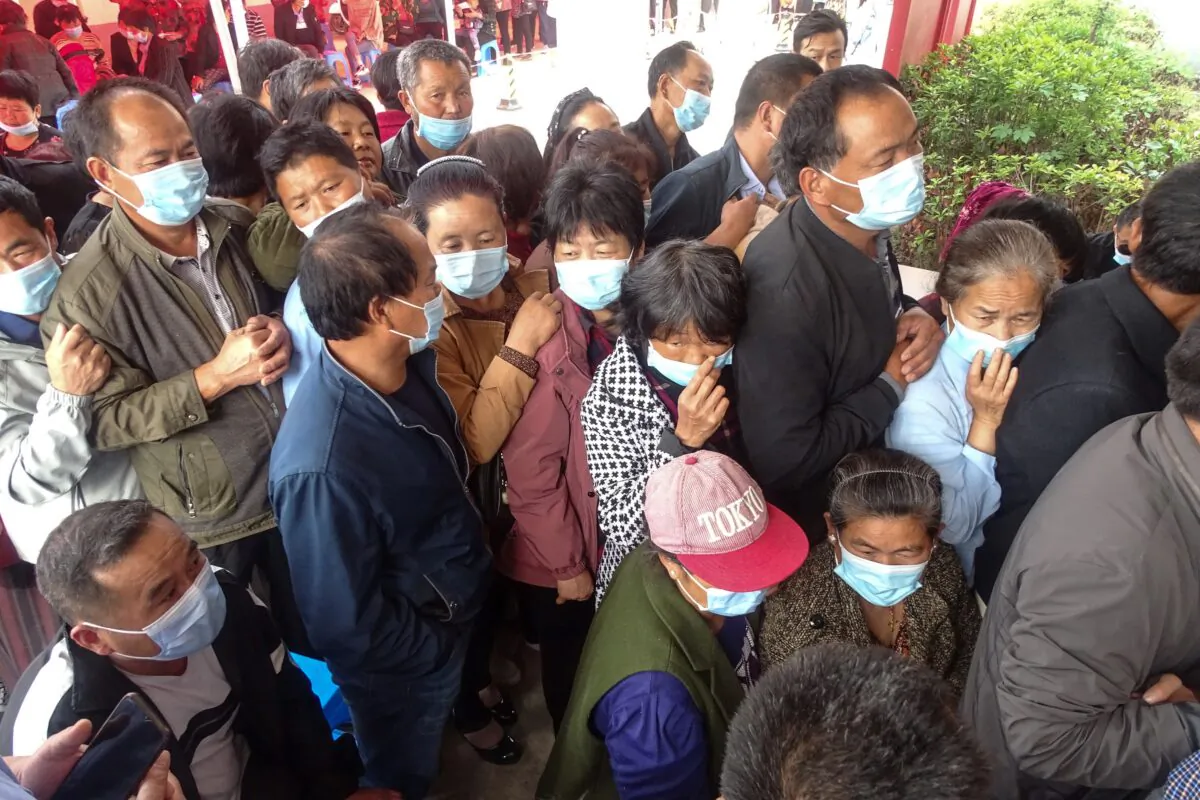 People wait to receive a COVID-19 vaccine in Linquan county, Fuyang city, in eastern China's Anhui province on May 13, 2021. (AFP via Getty Images)