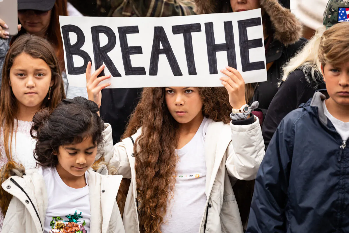 Parents and students gather in protest of wearing masks in schools in front of the Orange County Board of Education in Costa Mesa, Calif., on May 17, 2021. (John Fredricks/The Epoch Times)