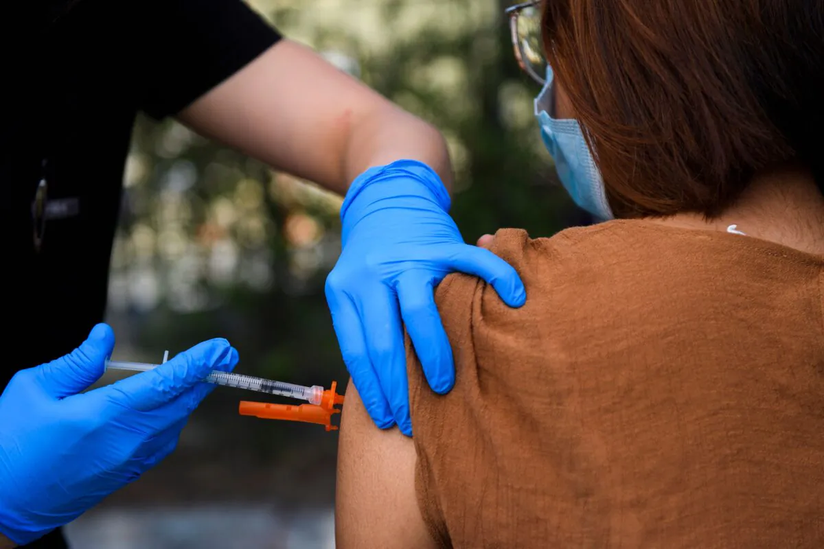 A 15-year-old receives a COVID-19 vaccine at a mobile vaccination clinic at the Weingart East Los Angeles YMCA in Los Angeles on May 14, 2021. (Patrick T. Fallon/AFP via Getty Images)