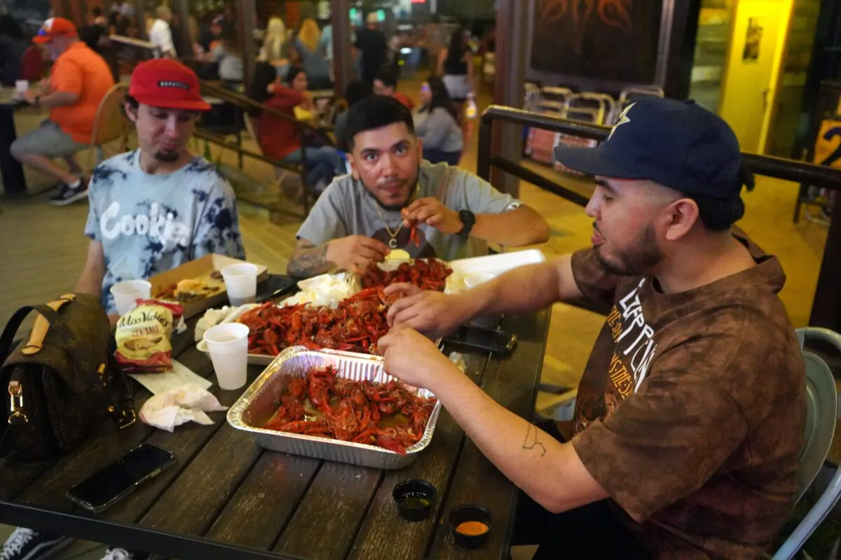 People drink and eat at Truck Yard beer garden in Houston, Texas, on April 9, 2021. (Francois Picard/AFP via Getty Images)