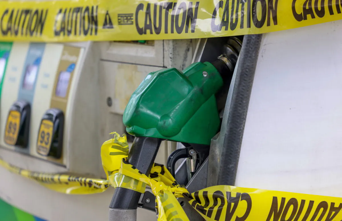 Gas pumps are roped off with a tape indicating a lack of gasoline at a gas station in Washington on May 14, 2021. (Evelyn Hockstein/Reuters)