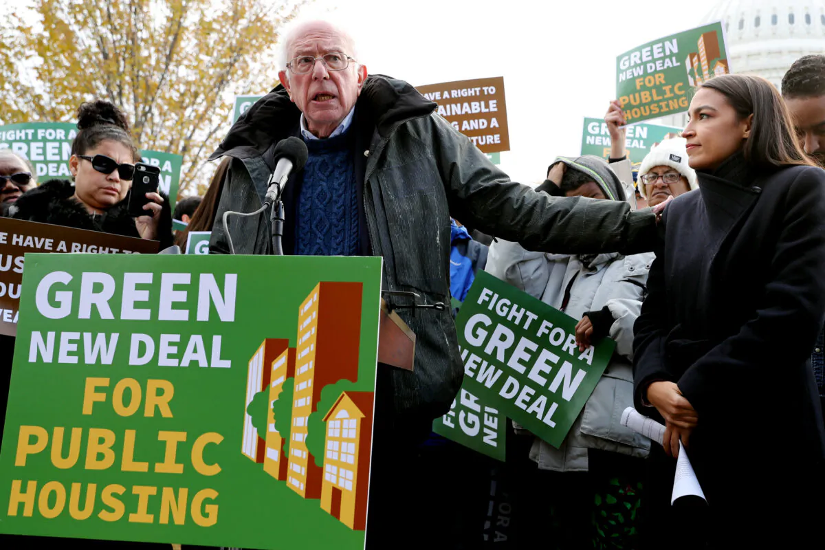 Then-Democratic presidential candidate Sen. Bernie Sanders (I-Vt.) (L) and Rep. Alexandria Ocasio-Cortez (D-N.Y.) hold a news conference to introduce legislation to transform public housing as part of their Green New Deal proposal outside the U.S. Capitol in Washington on Nov. 14, 2019, DC. (Chip Somodevilla/Getty Images)