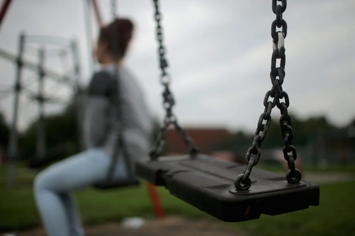 A teenage girl, who says she was a victim of sexual abuse and alleged grooming, in Rotherham, England, on Sept. 3, 2014. (Christopher Furlong/Getty Images)