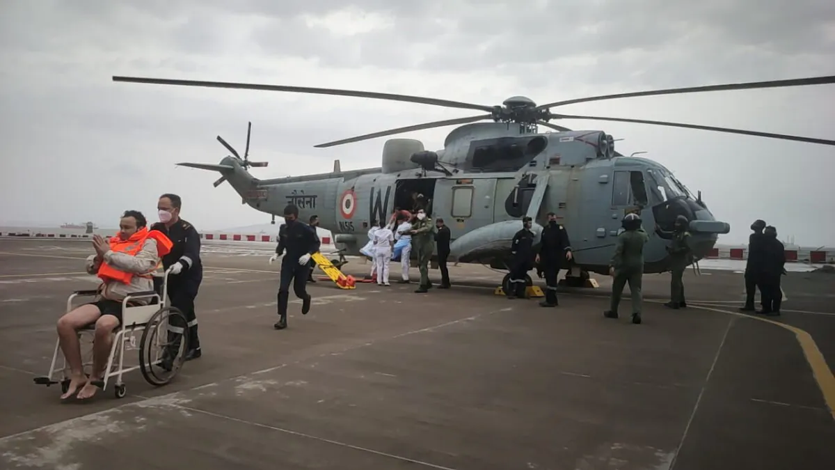 A man gestures after he was rescued by Indian Navy personnel from a sunken barge, at naval air station INS Shikra in Mumbai, India, on May 18, 2021. (Indian Navy/Handout via Reuters) 
