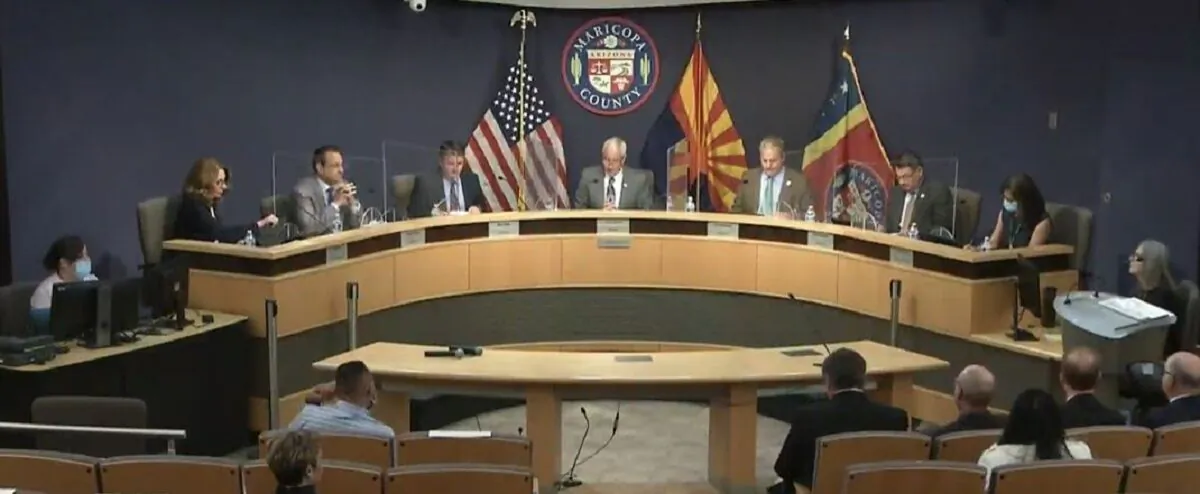 In this image from video captured from the Maricopa County Board of Supervisors website, Chairman Jack Sellers, center, and members hold a meeting regarding requests by the Arizona Senate in Maricopa County, Ariz., on May 18, 2021. (Screenshot via The Epoch Times)