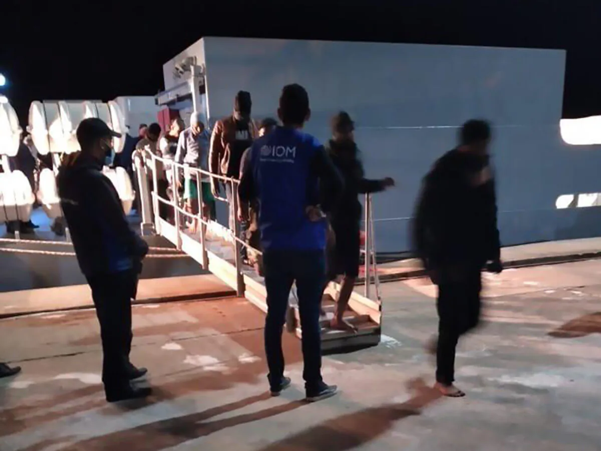 Migrants disembarking in Tunisia, late Monday, on May 17, 2021. (IOM Tunisia via AP)