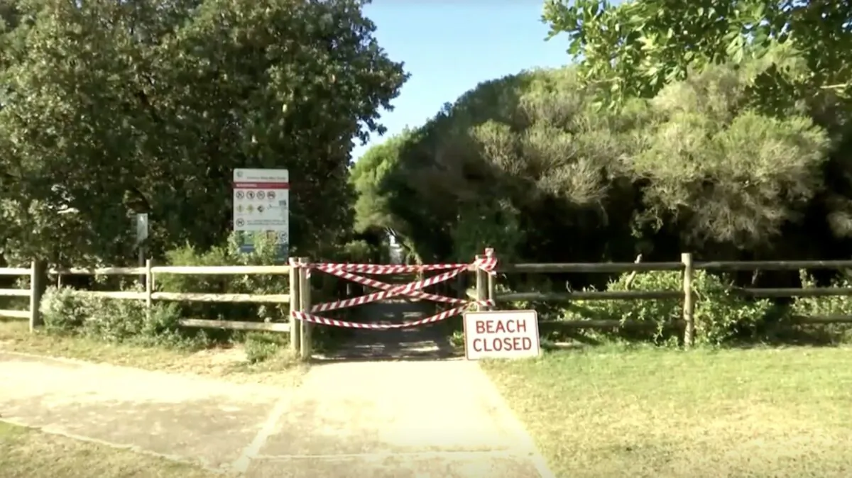 A screenshot showing a "Beach Closed" sign and a taped off entrance to Tuncurry beach in New South Wales, Australia, on May 18, 2021. (Australian ABC via Reuters/Screenshot via NTD)