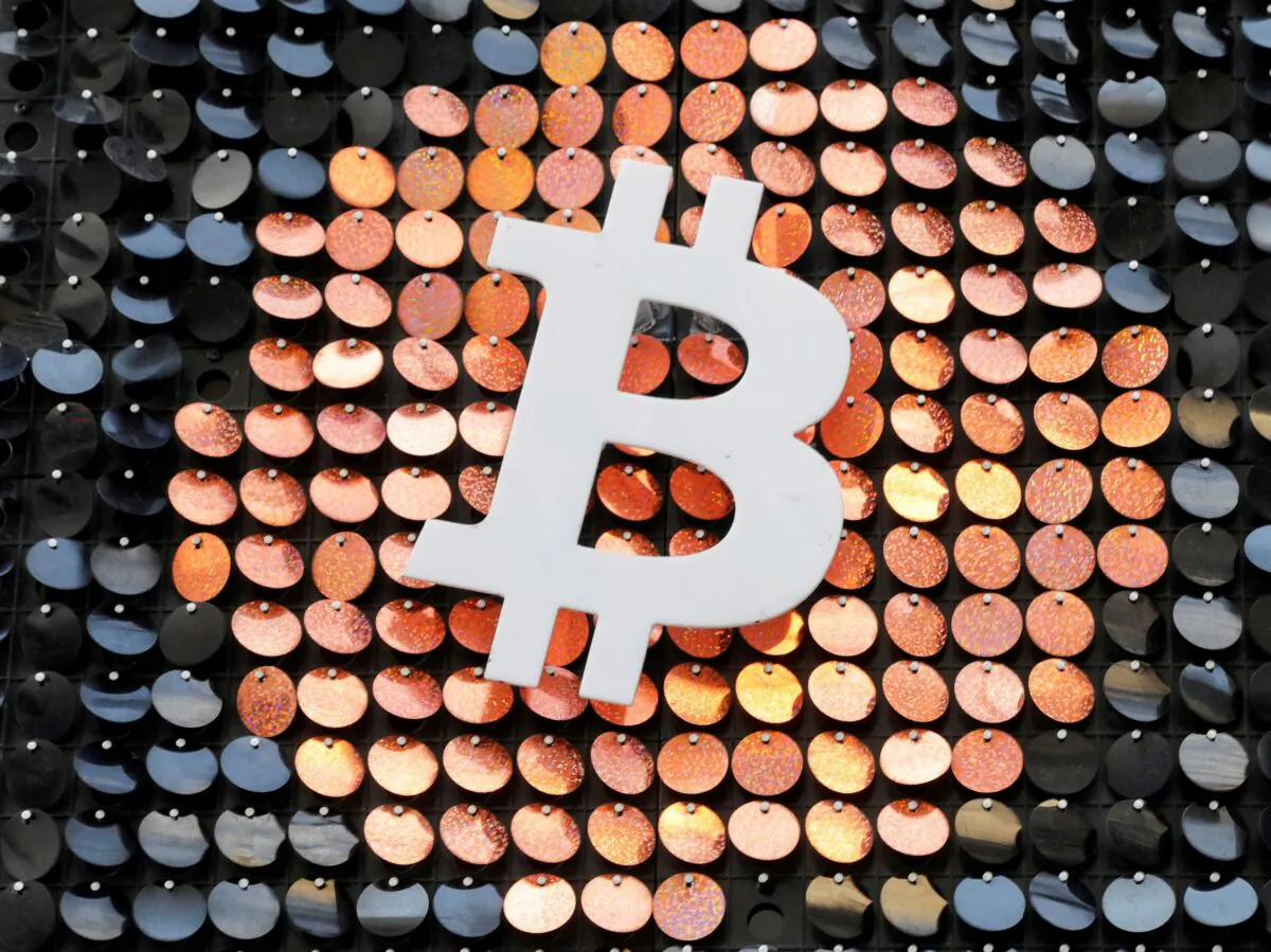 The logo of the Bitcoin digital currency is seen in a shop in Marseille, France, on Feb. 7, 2021. (Eric Gaillard/Reuters)