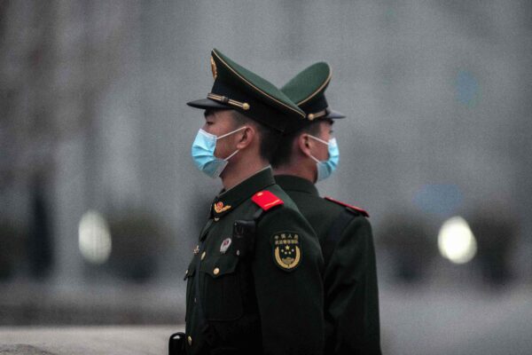 Chinese soldiers stand guard