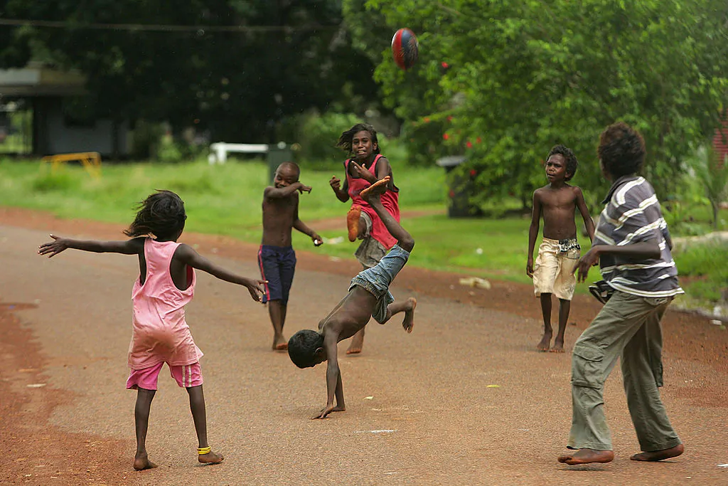 Children play football on the street on Tiwi Island on the December 23, 2007. (Ezra Shaw/Getty Images)