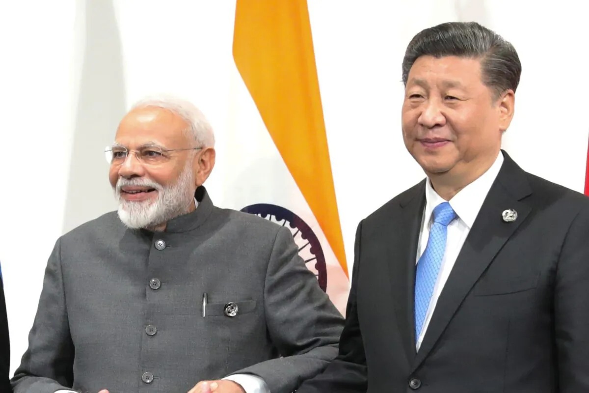 Indian Prime Minister Narendra Modi and Chinese President Xi Jinping hold a meeting on the sidelines of the G20 summit in Osaka, on June 28, 2019. (Mikhail Klimentyev/SPUTNIK/AFP via Getty Images)