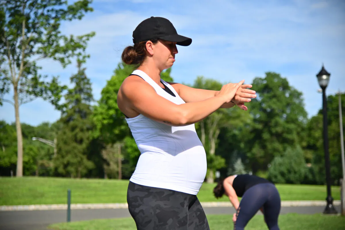 Pregnant fitness instructor Caitlin Lackaye leads an outdoor socially distanced class as part of her Strength Garage studio in Berkeley Heights, N.J., on Aug. 3, 2020. (Theo Wargo/Getty Images)