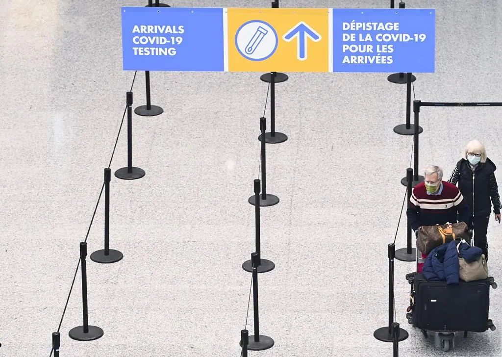 Travellers are directed to take a mandatory COVID-19 test after arriving on a international flight at Pearson International Airport during the COVID-19 pandemic in Toronto, on Feb. 1, 2021.  (Nathan Denette/The Canadian Press)