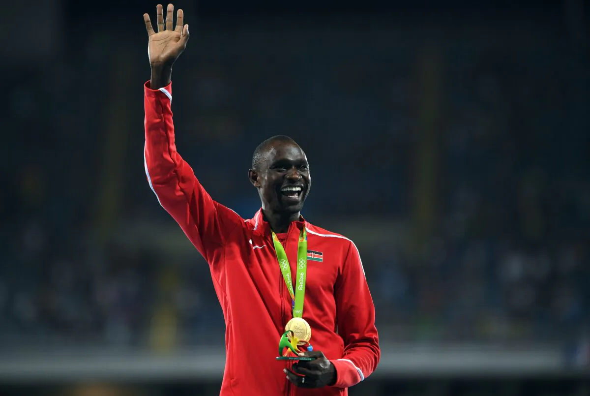 Gold medallist Kenya's David Lekuta Rudisha celebrates on the podium for the Men's 800 meter during the athletics at the Rio 2016 Olympic Games at the Olympic Stadium in Rio de Janeiro, on Aug. 16, 2016.  (Johannes Eisele/AFP via Getty Images)