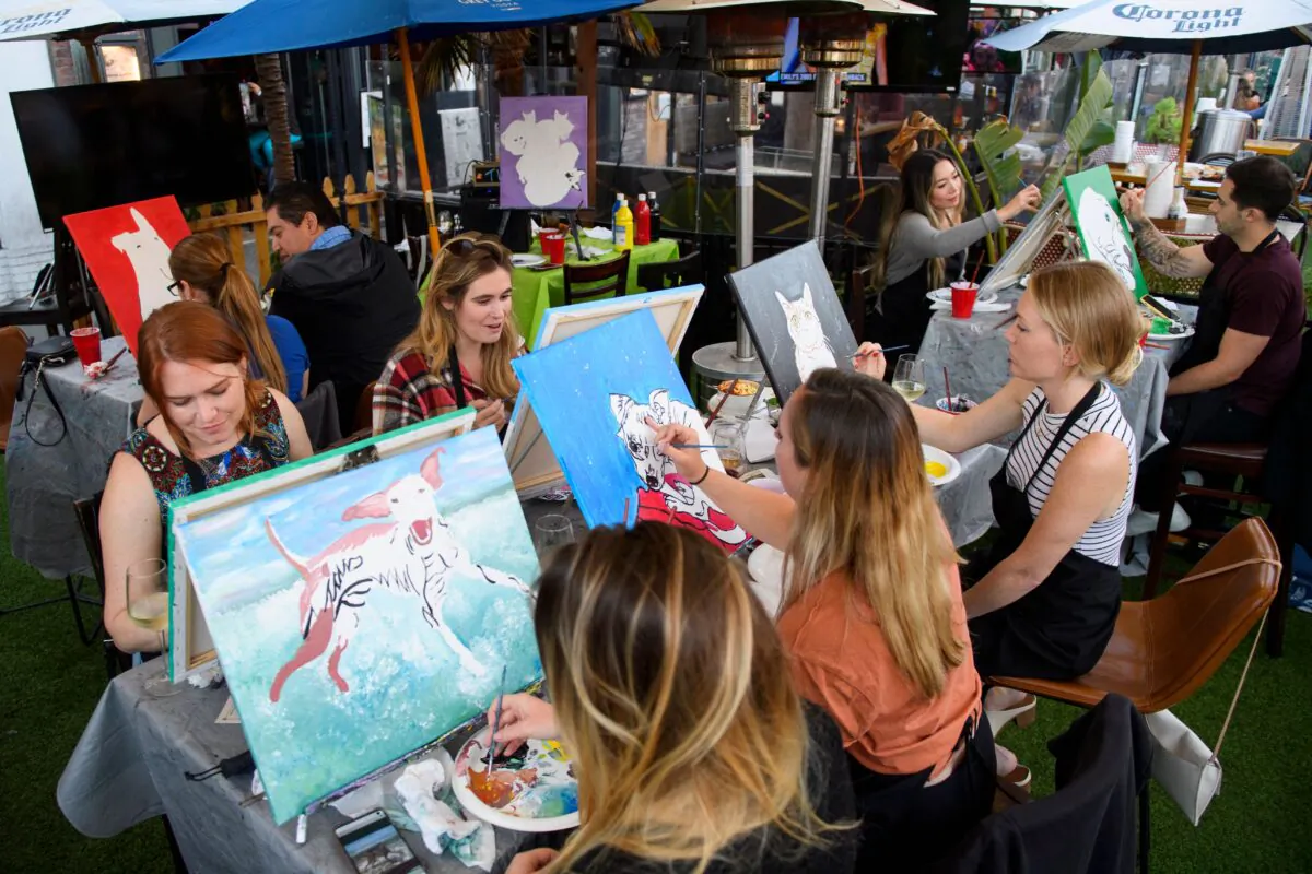 Customers paint during a class in Huntington Beach, Calif., on May 19, 2021. (Patrick T. Fallon/AFP via Getty Images)