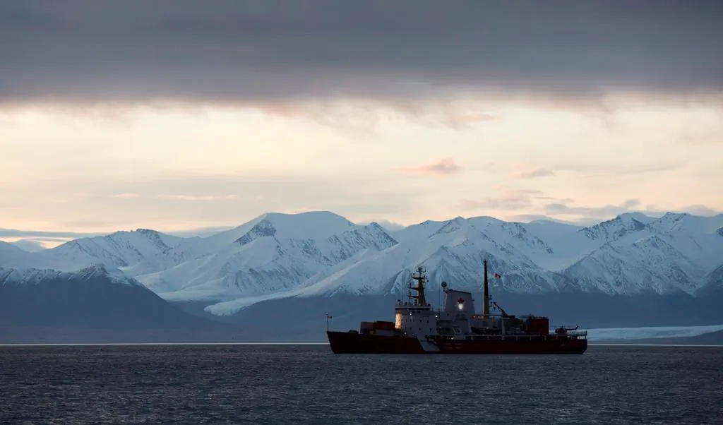 The Coast Guard ship Des Groseilliers sits at anchor off the hamlet of Pond Inlet, Nunavut on August 23, 2014. (Adrian Wyld/The Canadian Press)