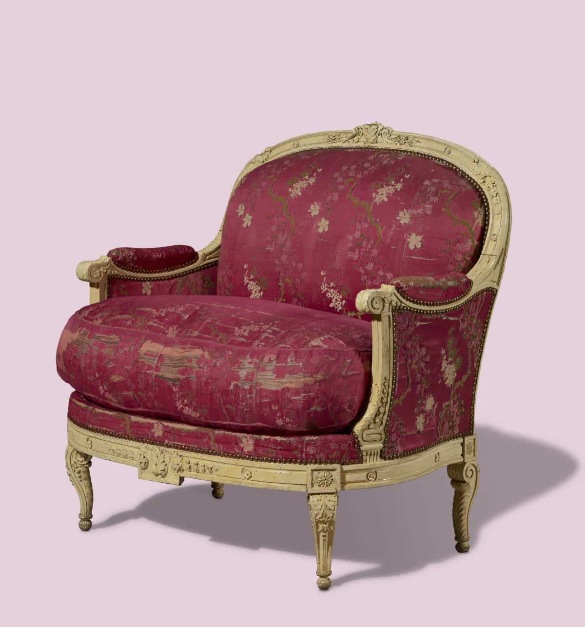 Detail of the armchair (Bergère), 1770–72 or early 1780s, French, by Georges Jacob. Walnut, painted and varnished, and beech; silk, linen, hemp, and horsehair upholstery with swan- and goose-down feather stuffing; silk trim; iron tacks and gilt-brass nails. 3 feet 3 inches high by 3 feet 1 inch wide by 2 feet 6 inches deep. The J. Paul Getty Museum. (The J. Paul Getty Museum)
