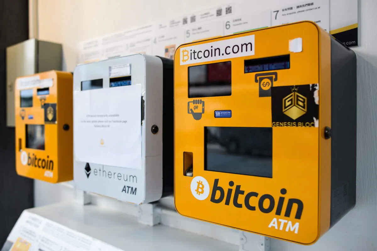 ATM machines (L and R) for the digital currency Bitcoin shown in Hong Kong, on December 18, 2017 are on the way out in China. (Photo by Anthony Wallace / AFP via Getty Images)