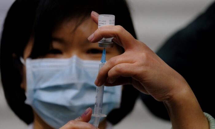 A medical staff member prepares a COVID-19 vaccine dose at the Far Eastern Memorial Hospital in New Taipei City, Taiwan, on March 22, 2021. (Sam Yeh/AFP via Getty Images)