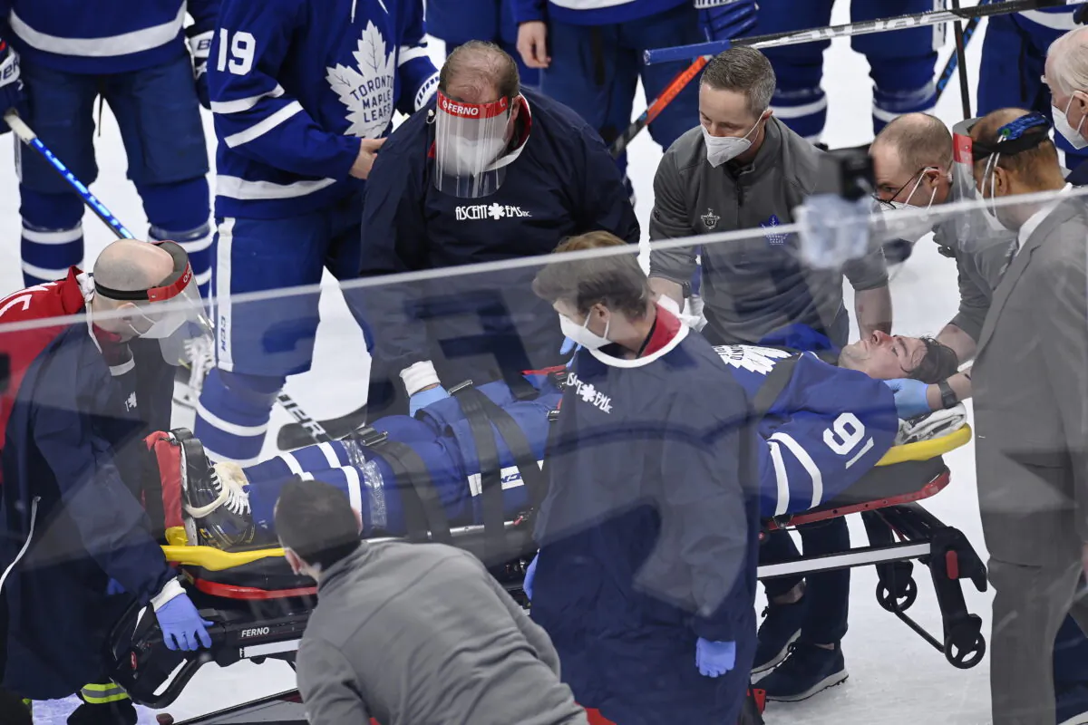 Toronto Maple Leafs forward John Tavares (91) is helped onto a stretcher after being injured during the first period against the Montreal Canadiens in Game 1 of an NHL hockey Stanley Cup first-round playoff series in Toronto, Canada, on May 20, 2021. (Frank Gunn/The Canadian Press via AP)