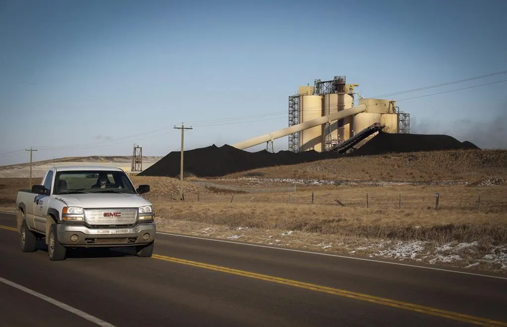 A conveyor belt transports coal at the Westmoreland Coal Company's Sheerness Mine near Hanna, Alta., on Dec. 13, 2016. (Jeff McIntosh/The Canadian Press)