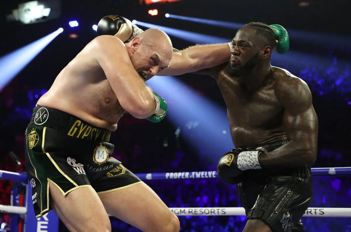 Deontay Wilder punches Tyson Fury during their Heavyweight bout for Wilder's WBC and Fury's lineal heavyweight title, at MGM Grand Garden Arena in Las Vegas, Nev., on Feb. 22, 2020. (Al Bello/Getty Images)