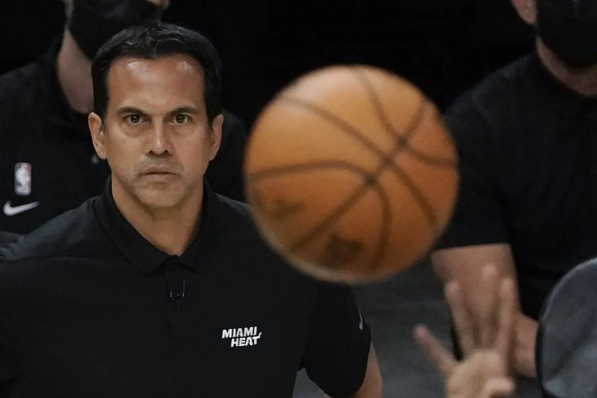 Miami Heat head coach Erik Spoelstra watches a shot during the first half of Game 1 of their NBA basketball first-round playoff series against the Milwaukee Bucks in Milwaukee, Wis., on May 22, 2021. (Morry Gash/AP Photo)