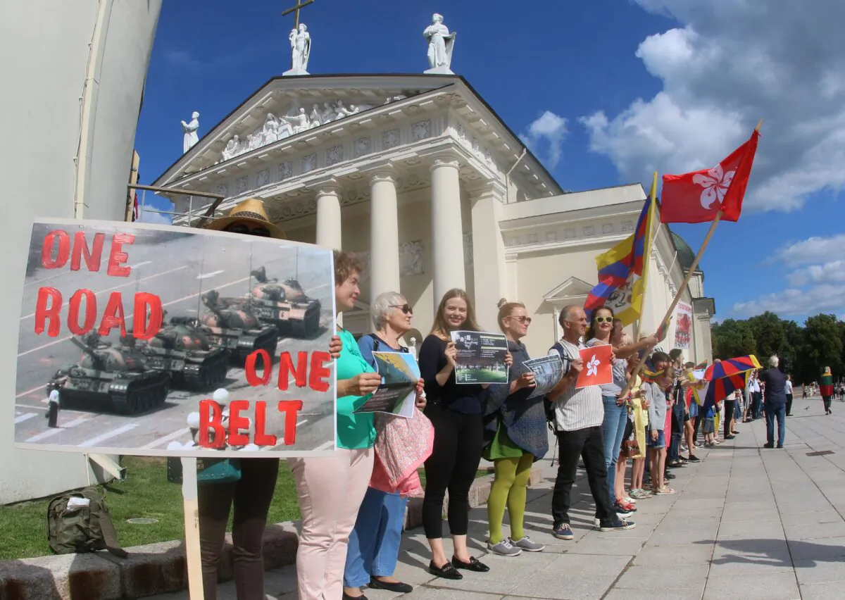 People take part in a human chain protest in support of the Hong Kong Way, a recreation of a pro-democracy "Baltic Way" protest against Soviet rule three decades ago, in Vilnius, Lithuania, on Aug. 23, 2019. (Petras Malukas/AFP via Getty Images)