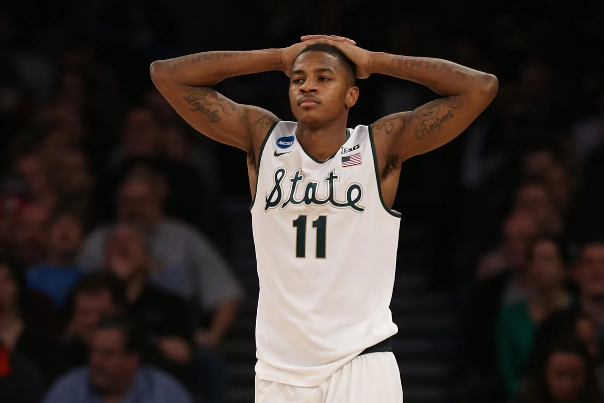 Keith Appling #11 of the Michigan State Spartans reacts against the Connecticut Huskies during the East Regional Final of the 2014 NCAA Men's Basketball Tournament at Madison Square Garden in New York City on March 30, 2014. (Bruce Bennett/Getty Images)