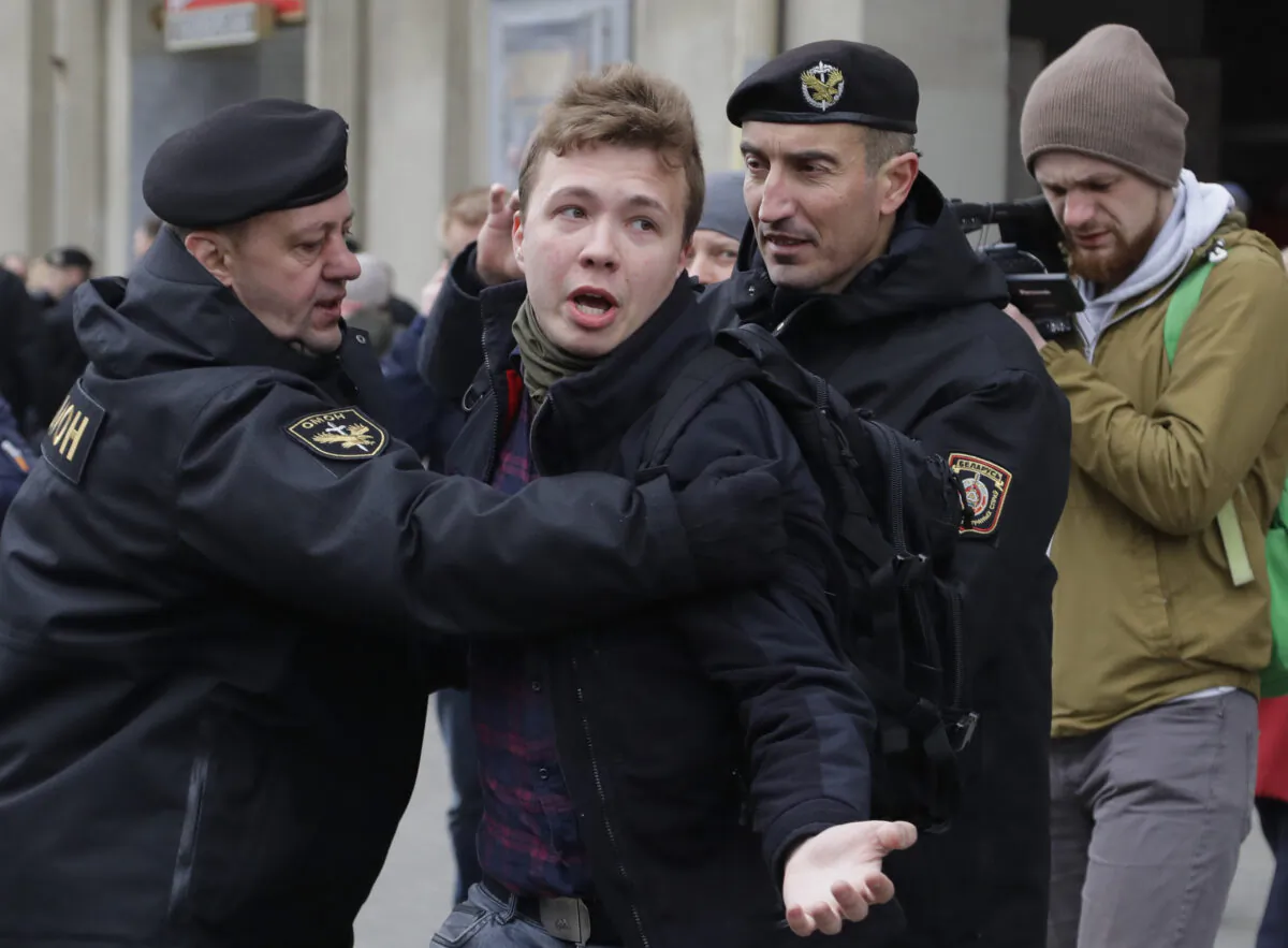 Belarus police detain journalist Raman Pratasevich, center, in Minsk, Belarus, on March 26, 2017. ﻿﻿(Sergei Grits/AP Photo)