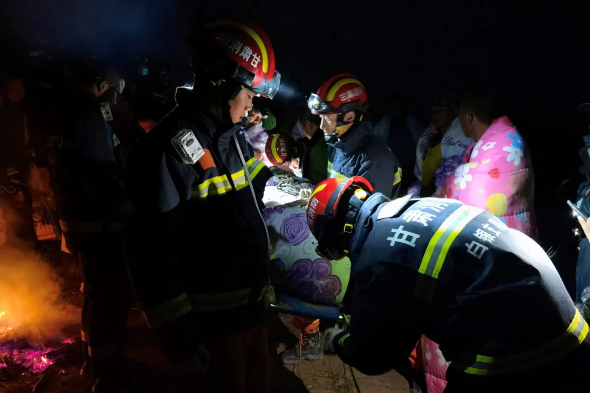 Rescuers assisting people who were competing in a 100-kilometer cross-country mountain race on May 22, 2021, when extreme weather hit near the city of Baiyin in China's northwestern Gansu province, leaving at least 20 dead. (AFP via Getty Images)