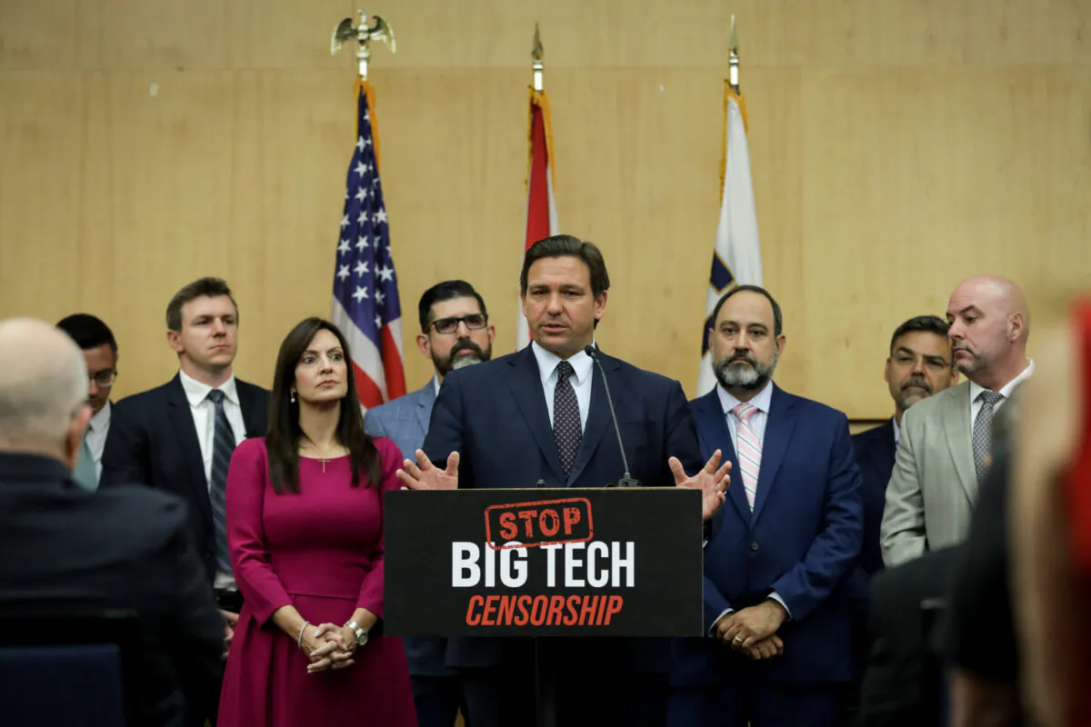Florida Gov. Ron DeSantis speaks before signing into law Senate Bill 7072 at Florida International University in Miami on May 24, 2021. (Samira Bouaou/The Epoch Times)