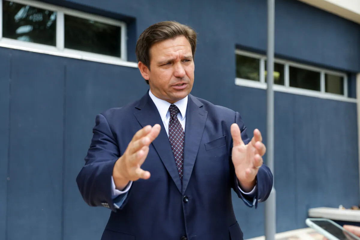 Florida Gov. Ron DeSantis departs after signing into law Senate Bill 7072 at Florida International University in Miami, Fla., on May 24, 2021. (Samira Bouaou/The Epoch Times)