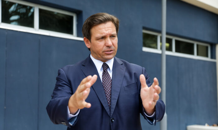 Florida Gov. Ron DeSantis departs after signing into law Senate Bill 7072 at Florida International University in Miami on May 24, 2021. (Samira Bouaou/The Epoch Times)