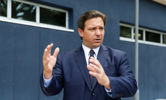 Florida Gov. Ron DeSantis departs after signing into law Senate Bill 7072 at Florida International University in Miami on May 24, 2021. (Samira Bouaou/The Epoch Times)