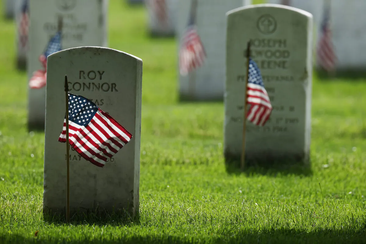 U.S. flags are placed in front of every grave site ahead of the Memorial Day weekend in Arlington National Cemetery in Arlington, Va., on May 21, 2020. (Chip Somodevilla/Getty Images)