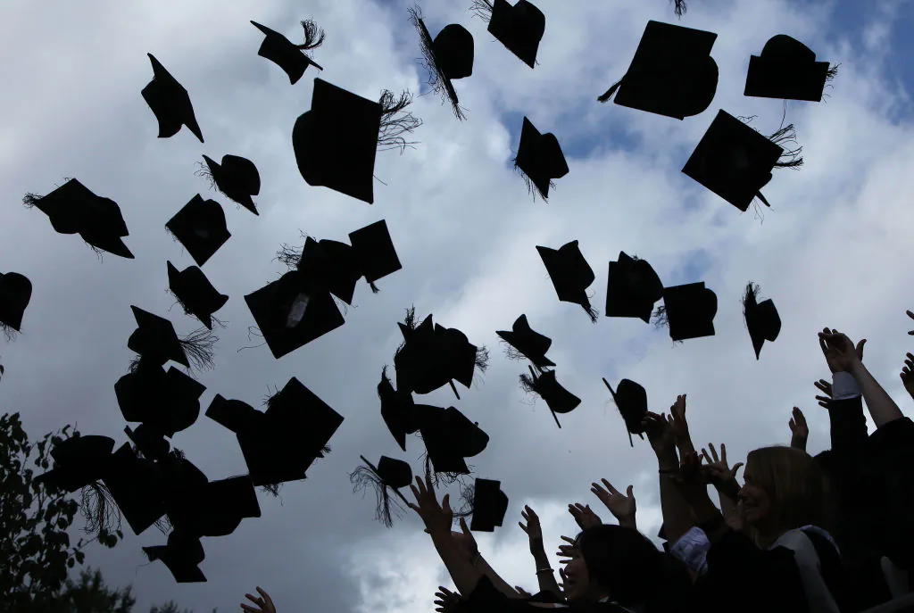 Students throw their caps in the air at the University of Birmingham in Birmingham, England, on July 14, 2009. (Christopher Furlong/Getty Images)