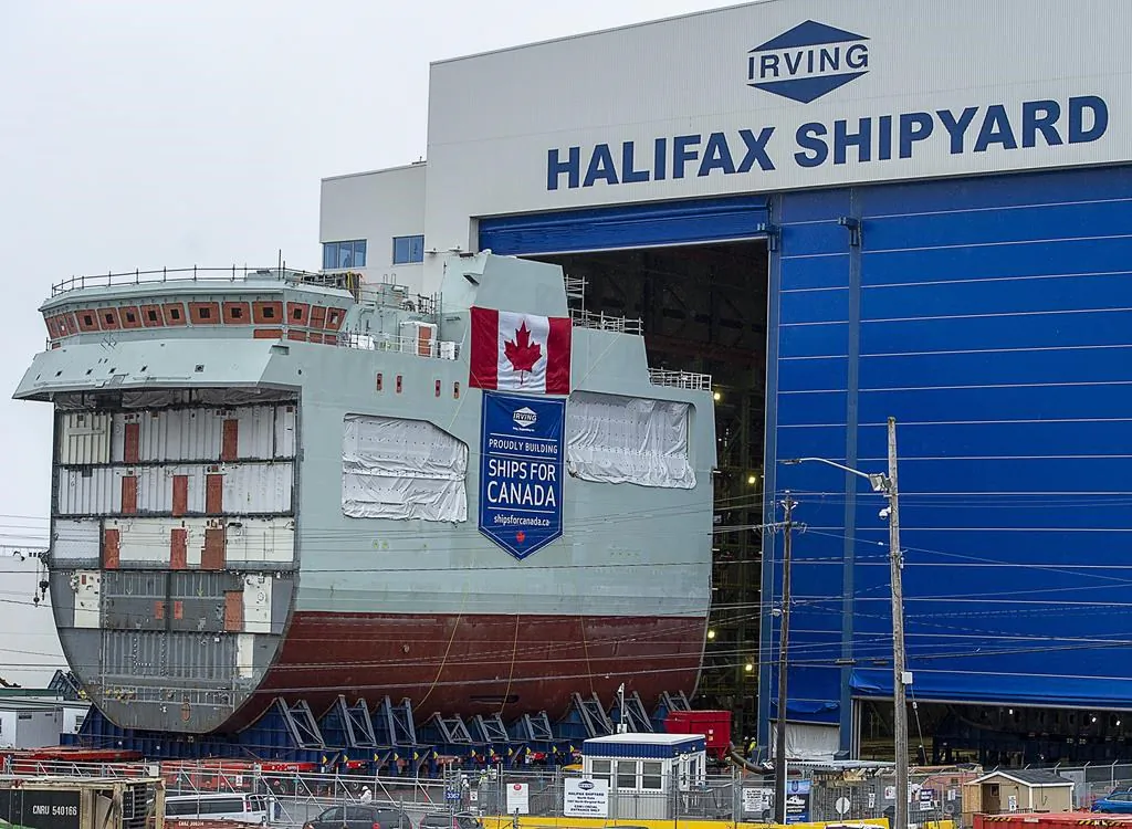 The centre block of the future HMCS Max Bernays is moved from the fabrication building to dockside at the Irving Shipbuilding facility in Halifax on Jan. 22, 2021.The vessel is Canada's third Arctic and Offshore Patrol Ship (AOPS) being built for the Royal Canadian Navy. The vessel is named for Max Bernays, who fought in the Battle of the Atlantic during the Second World War. Bernays was awarded the Conspicuous Gallantry Medal for his actions aboard HMCS Assiniboine 1942. (Andrew Vaughan/The Canadian Press)