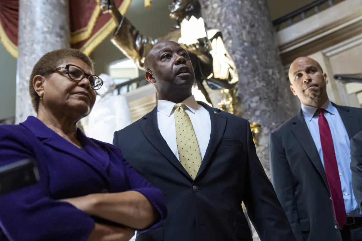 (L-R) Rep. Karen Bass (D-Calif.), Sen. Tim Scott (R-S.C.), and Sen. Cory Booker (D-N.J.) speak to reporters on Capitol Hill, in Washington, on May 18, 2021. (Drew Angerer/Getty Images)