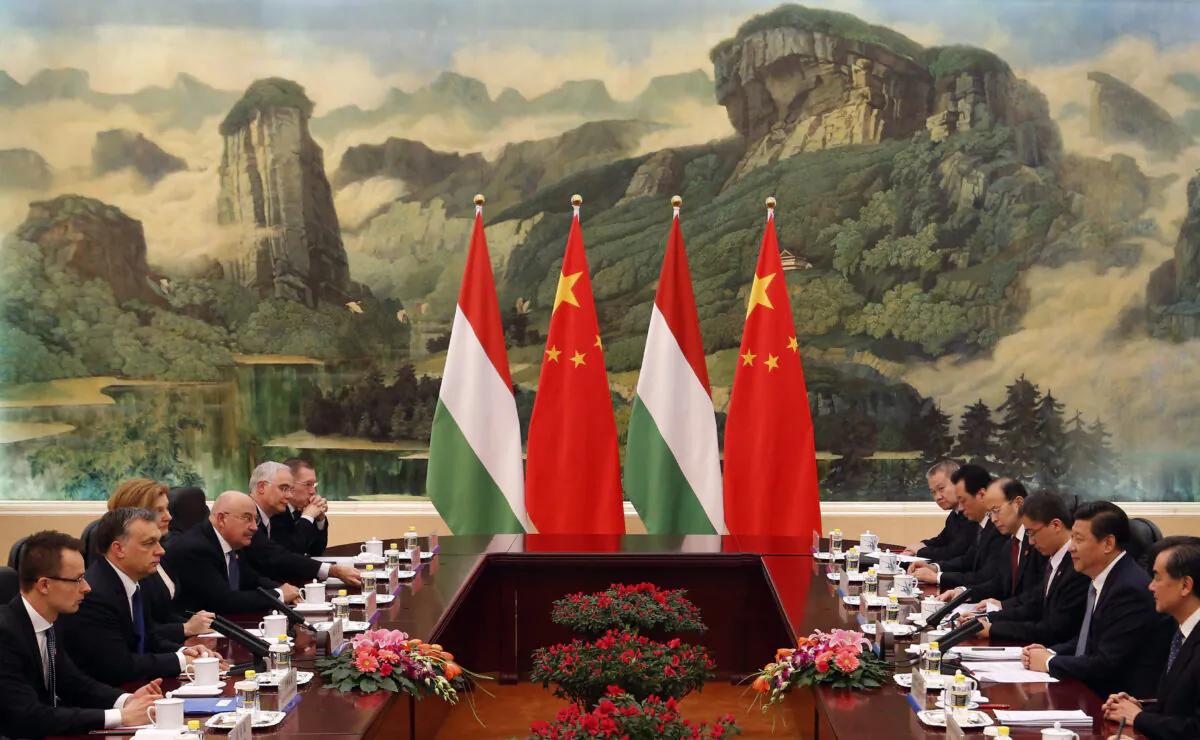 Hungary PM Viktor Orban (2nd L) and Chinese leader Xi Jinping (2nd R) lead their delegations in a meeting at the Great Hall of the People in Beijing on Feb. 13, 2014. (Rolex Dela Pena/AFP via Getty Images)